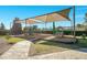 Outdoor playground featuring covered play structures, mulch ground cover, benches, and a secure perimeter fence at 13809 Abberwick Dr, Orlando, FL 32832