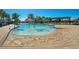 Community pool featuring a splash pad and ample seating for residents to enjoy at 13809 Abberwick Dr, Orlando, FL 32832