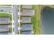 Aerial rooftop view highlighting the home's location, nearby street, and adjacent lake at 17795 Blazing Star Cir, Clermont, FL 34714