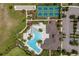 Aerial view of community amenities including a pool, tennis court, and bocce ball court at 17795 Blazing Star Cir, Clermont, FL 34714