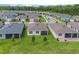 Aerial view of the home's backyard showcasing the lush lawn and landscaping at 17795 Blazing Star Cir, Clermont, FL 34714