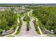 Scenic community entrance with palm trees and elegant signage, creating a welcoming atmosphere at 17795 Blazing Star Cir, Clermont, FL 34714