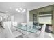 View of the dining area adjacent to the patio and kitchen, bathed in natural light at 17795 Blazing Star Cir, Clermont, FL 34714