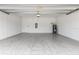 Spacious garage with tiled flooring, water heater, and ample room for storage and vehicles at 17795 Blazing Star Cir, Clermont, FL 34714