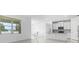 Open-concept kitchen and dining area with a view of the lake and fountain at 17795 Blazing Star Cir, Clermont, FL 34714