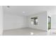 Bright and spacious living room with tile flooring and a large window with a view at 17795 Blazing Star Cir, Clermont, FL 34714