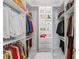 Spacious walk-in closet with custom shelving, drawers, and organized storage at 17795 Blazing Star Cir, Clermont, FL 34714