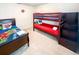 bedroom featuring a fun superhero theme with a bunk bed and a single bed, perfect for a shared space at 1876 Summer Dr, Davenport, FL 33897