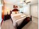 Comfortable bedroom with a queen bed, side tables and warm lighting, creating a soothing atmosphere at 1876 Summer Dr, Davenport, FL 33897