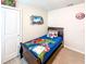 Fun bedroom with superhero-themed decorations, perfect for a or comic book enthusiast at 1876 Summer Dr, Davenport, FL 33897