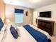 Relaxing bedroom with a TV and ensuite bathroom access, providing convenience and entertainment at 1876 Summer Dr, Davenport, FL 33897