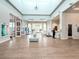 Spacious lobby area featuring tiled floors, an airy seating area, and large windows that let in plenty of natural light at 1876 Summer Dr, Davenport, FL 33897