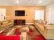 Comfortable living room with two sofas, flat-screen TV, and a modern rug at 1876 Summer Dr, Davenport, FL 33897