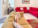 Comfortable living room with a red sofa, sectional, and stylish decor at 1876 Summer Dr, Davenport, FL 33897