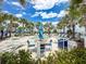 Resort-style pool area with hot tub, lounge chairs, tables, and lush palm trees in a beautiful outdoor setting at 1876 Summer Dr, Davenport, FL 33897