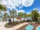 Playful splash pad area with a variety of water features and lounge chairs around the pool at 1876 Summer Dr, Davenport, FL 33897