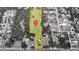 Aerial view of large lot outlined with a red border pinpoints the property location in a neighborhood surrounded by trees at 1886 Pleasant Hill Rd, Kissimmee, FL 34746