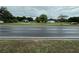 Street view with properties in background. Houses need TLC at 1886 Pleasant Hill Rd, Kissimmee, FL 34746