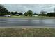 Street view with properties in background. Houses need TLC at 1886 Pleasant Hill Rd, Kissimmee, FL 34746