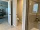 Bathroom features a walk-in shower and a toilet inside a separate water closet at 1896 Basenji Dr, Lake Alfred, FL 33850