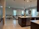 Open-concept kitchen flows into the living and dining areas, creating a modern and inviting space at 1896 Basenji Dr, Lake Alfred, FL 33850