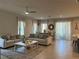 Spacious living room featuring neutral decor, tile floors, and an open layout at 1896 Basenji Dr, Lake Alfred, FL 33850