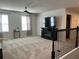 Spacious living room with a ceiling fan and entertainment center, perfect for relaxation and entertainment at 1896 Basenji Dr, Lake Alfred, FL 33850