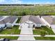 An aerial view of a well maintained home and surrounding area with manicured lawns at 1951 Partin Terrace Rd, Kissimmee, FL 34744