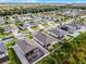 Aerial view of a home with a well-maintained lawn and a red outline of the property boundary at 1951 Partin Terrace Rd, Kissimmee, FL 34744