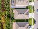 Aerial view of the property showcasing the roof, backyard, and surrounding neighborhood at 1951 Partin Terrace Rd, Kissimmee, FL 34744