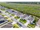 Beautiful aerial view of a home with an outlined property line, green lawn, and surrounding community at 1951 Partin Terrace Rd, Kissimmee, FL 34744