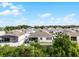 Backyard shot showing white picket fence and view of neighboring houses at 1951 Partin Terrace Rd, Kissimmee, FL 34744