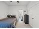 Bedroom showcasing neutral carpet, ceiling fan, and ensuite bathroom at 1951 Partin Terrace Rd, Kissimmee, FL 34744