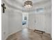 Tiled entryway features a decorative light fixture, a wooden cross, and a view into the home at 1951 Partin Terrace Rd, Kissimmee, FL 34744