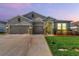 Charming home featuring a well-manicured lawn, a two-car garage, and stone accents at 1951 Partin Terrace Rd, Kissimmee, FL 34744