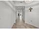Long hallway features tile flooring and recessed lighting, leading to the rest of the home at 1951 Partin Terrace Rd, Kissimmee, FL 34744