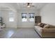 Living room with tile floors and comfortable seating at 1951 Partin Terrace Rd, Kissimmee, FL 34744