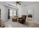 Welcoming living room features tile flooring, ceiling fan, and cozy seating for relaxation and entertainment at 1951 Partin Terrace Rd, Kissimmee, FL 34744