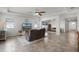 Spacious living room featuring tile floors, natural light, and a cozy seating area at 1951 Partin Terrace Rd, Kissimmee, FL 34744