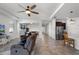 Open-concept living area featuring tile floors, a ceiling fan, and seamless transition to the kitchen at 1951 Partin Terrace Rd, Kissimmee, FL 34744
