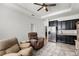 Inviting living room with kitchenette, stainless steel appliances, and comfortable seating arrangement at 1951 Partin Terrace Rd, Kissimmee, FL 34744
