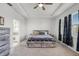 Spacious main bedroom features a ceiling fan, tray ceiling, and carpet flooring at 1951 Partin Terrace Rd, Kissimmee, FL 34744