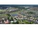 Community aerial showcasing many homes, ponds, green spaces, and a golf course at 2016 Lakeside Ave, Davenport, FL 33837