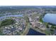Panoramic aerial view showcases a well-planned community with houses, ponds and lush landscaping at 2016 Lakeside Ave, Davenport, FL 33837