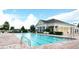 Stunning community pool with a clubhouse and ample seating for residents to relax and enjoy at 2016 Lakeside Ave, Davenport, FL 33837