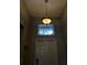 Stylish foyer showcasing a front door, pendant lighting, and small window above at 2016 Lakeside Ave, Davenport, FL 33837