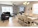 Spacious dining and living area with tile floors, lots of natural light, and modern decor at 2016 Lakeside Ave, Davenport, FL 33837