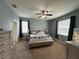 Comfortable main bedroom featuring carpeted floors, abundant natural light, and neutral paint at 2016 Lakeside Ave, Davenport, FL 33837
