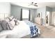 Spacious main bedroom with light-blue walls, carpet floors, ceiling fan and a walk-in closet at 2016 Lakeside Ave, Davenport, FL 33837