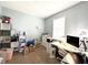 Comfortable office space with white desk, shelves, and a large window at 2016 Lakeside Ave, Davenport, FL 33837
